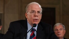 FILE - Then Acting CIA Director John McLaughlin at a Senate hearing on at the U.S. Capitol in 2004.