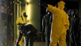 A hazardous materials crew examines an area at Kuala Lumpur International Airport in Sepang, Malaysia, Feb. 26, 2017. Malaysian officials say Kim Jong Nam was poisoned with nerve agent.