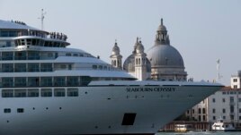 In this Sept. 27, 2014 file photo a cruise ship transits in the Giudecca canal in front of St. Mark's Square, in Venice, Italy. (AP Photo/Andrew Medichini)
