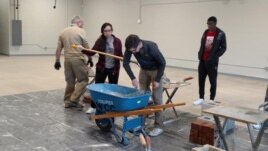 High school students from the Waterloo Community School District take part in construction traning at their school. The students spent five days at their school learning from experienced workers from the Masonry Institute of Iowa. (Masonry Institute of Io