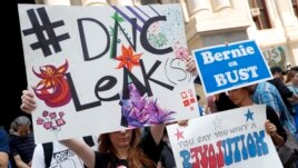 Demonstrators make their way around downtown, Monday, July 25, 2016, in Philadelphia, during the first day of the Democratic National Convention after some of the 19,000 emails, presumably stolen from the DNC by hackers, were posted to the website Wikilea