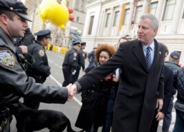 New York City Bill de Blasio, right, at New York's Thanksgiving Day Parade.