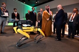 Saudi Crown Prince Mohammed bin Salman visits a demonstration of technology, including a robotic 