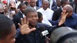 Joao Lourenco, shows his ink-stained finger after casting his vote in elections in Luanda, Angola on August 23, 2017. (AP Photo/Bruno Fonseca, File)