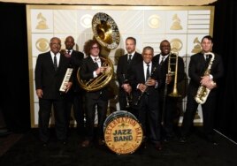 The Preservation Hall Jazz Band poses in the press room at the 58th annual Grammy Awards in Los Angeles, on Feb. 15, 2016.