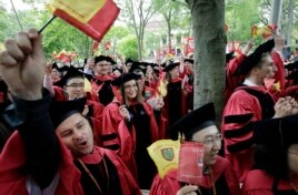 Harvard University students graduating with masters degrees in philosophy celebrate during Harvard University's commencement exercises, Thursday, May 30, 2019, on the schools campus in Cambridge, Massachusetts.