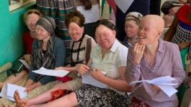 Women living with albinism attend a class at Women and Children with Albinism on the outskirts of Kampala, Uganda, to learn how to make organic soap as a means of earning a living.