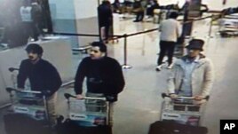 In this image provided by the Belgian Federal Police in Brussels on Tuesday, March 22, 2016 of three men who are suspected of taking part in the attacks at Belgium's Zaventem Airport.