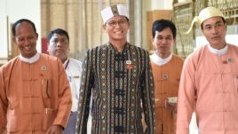 Lawmaker Henry Van Hti Yu walks into the parliament in Naypyitaw, Myanmar, Thursday, March 10, 2016.(AP Photo/Soe Gyi)