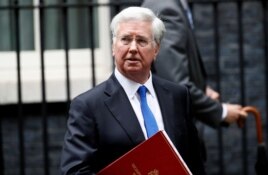 FILE - Britain's Minister of Defense Michael Fallon