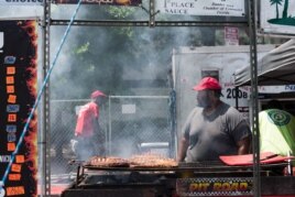 An employee of Smoke Shack waits for ribs to cook on Sunday, June 25, 2017 at the National Capital Barbecue Battle in Washington D.C.