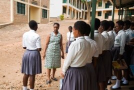 Josephine Kobusingye, an education activist, mentors a group of female science students. She says supporting them is crucial because many of them are facing dificult family situations.