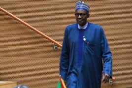 Nigeria's President Muhammadu Buhari walks after speaking at the opening of the Ordinary Session of the Assembly of Heads of State and Government during the 30th annual African Union summit in Addis Ababa, Jan. 28, 2018.