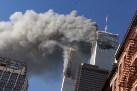 In this Sept. 11, 2001 file photo, smoke rising from the burning twin towers of the World Trade Center after hijacked planes crashed into the towers, in New York City.