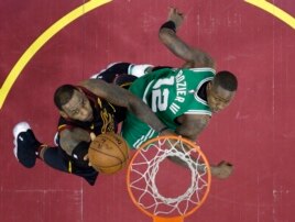 FILE - Cleveland Cavaliers' LeBron James, left, drives to the basket against Boston Celtics' Terry Rozier in the second half of Game 3 of the NBA basketball Eastern Conference finals Saturday, May 19, 2018, in Cleveland.