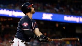 Washington Nationals center fielder Bryce Harper (34) watches his solo home run during the first inning of a baseball game against the New York Mets at Nationals Park, Wednesday, Sept. 9, 2015, in Washington.