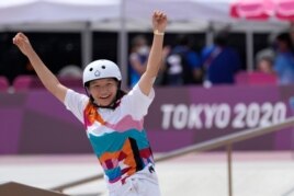 Momiji Nishiya of Japan reacts after winning the women's street skateboarding finals at the 2020 Summer Olympics, Monday, July 26, 2021, in Tokyo, Japan. (AP Photo/Ben Curtis)