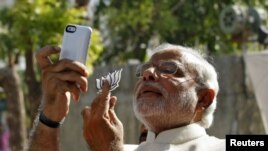 FILE - Hindu nationalist Narendra Modi, the prime ministerial candidate for India's main opposition Bharatiya Janata Party (BJP), takes a 