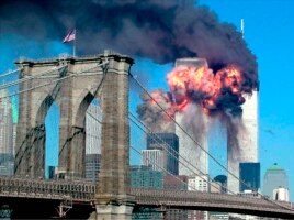 The second tower of the World Trade Center bursts into flames after being hit by a hijacked airplane in New York in this September 11, 2001 file photograph.