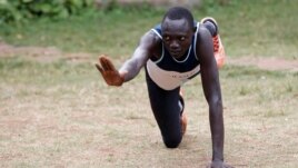 FILE - Paulo Amotun Lokoro, a refugee from South Sudan, part of the refugee athletes who qualified for the 2016 Rio Olympics, stretches during a training session in Ngong township near Kenya's capital Nairobi, June 9, 2016.