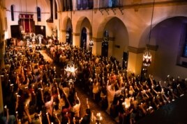 Students meet for a special event inside the Knowles Memorial Chapel at Rollins College in Winter Park, Florida.