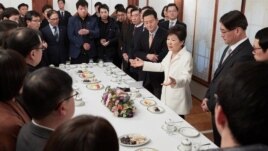 FILE - South Korean President Park Geun-hye speaks during a meeting with reporters at the Presidential Blue House in Seoul, South Korea, in this handout picture provided by the Presidential Blue House and released by Yonhap, Jan. 1, 2017.