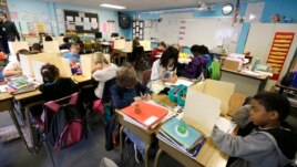 In this April 18, 2014 file photo, students are shown in a fourth-grade classroom at Olympic View Elementary School in Lacey, Washington. (AP Photo/Ted S. Warren)