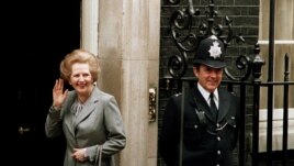 FILE - In this May 11, 1987 file photo, Britain's Prime Minister Margaret Thatcher waves to members of the media on returning to No. 10 Downing Street from Buckingham Palace after a visit with Queen Elizabeth II.