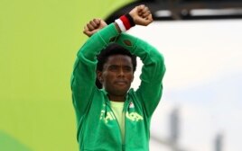 Fayisa Lilesa won the silver medal in the Olympic marathon. He protested Ethiopia's treatment of the Oromo people.