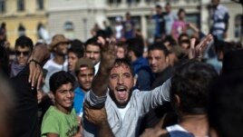 A man shouts during a protest at the Keleti train station in Budapest, Sept. 4, 2015.