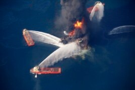 FILE - The Deepwater Horizon oil rig burns in the Gulf of Mexico, April 21, 2010, after an explosion that killed 11 workers and caused the worst offshore oil spill in the nation's history.