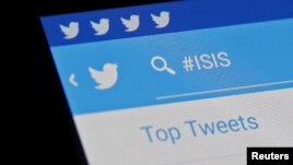 FILE - The Islamic State hashtag (#ISIS) is seen typed into the Twitter application on a smartphone in this picture illustration taken in Zenica, Bosnia and Herzegovina.