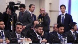 Mohammad Alloush (center), the head of the Syrian opposition delegation, attends Syria peace talks in Astana.