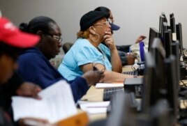 Student work on computers during a low level mathematics course at Baltimore City Community College in Baltimore, Maryland.