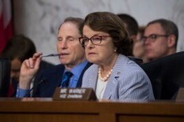 Senator Dianne Feinstein, right, joined at left by Sen. Ron Wyden listen as formerFBI director James Comey testifies.