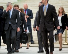 Former Virginia Gov. Bob McDonnell, left, with his wife Maureen McDonnell, right, leave the Supreme Court last year.