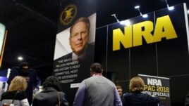 People sign up at the booth for the National Rifle Association at the Conservative Political Action Conference at National Harbor, Maryland, Feb. 23, 2018.