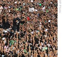 Mir Hossein Mousavi with supporters in Tehran on Thursday, in a photo released by his campaign media operation, Ghalam News