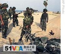 A Defense Ministry photo shows army soldiers patrolling Friday in the war zone