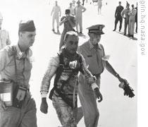 Gus Grissom arrives aboard U.S.S. Randolph after his short spaceflight