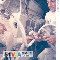 John Swigert holds the device that would clean carbon dioxide from the air in the lunar module