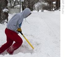 A December storm left heavy snow to clear off a sidewalk in Omaha, Nebraska