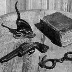 The tools of Texas lawman Judge Roy Bean: a notary seal, a book of law, handcuffs and a gun The tools of Texas lawman Judge Roy Bean: a notary seal, a book of law, handcuffs and a gun