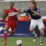 The Chicago Fire's Mike Banner, left, fights for the ball in a file photo from last year 