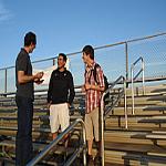 Steve Wilson visits with Martin Maldonado-Cortez and Miguel 'Angel' Arellano, two players in the book, 'The Boys From Little Mexico.'