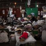 Cholera victims gathered in Cap Haitien, Haiti, in November.  Poor conditions after the earthquake in January have helped disease spread 