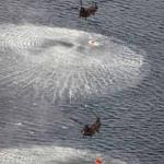 Japan's Self-Defense Forces's helicopters scoop water off Japan's northeast coast on their way to the Fukushima Dai-ichi nuclear power plant in Okumamachi.