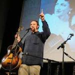 John Carter Cash holds up his grandmother Maybelle Carter's Gibson L-5 guitar during a celebration at the Country Music Hall of Fame Museum in Nashville. 